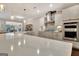 Spacious kitchen with island, stainless steel appliances, and stone countertops at 609 Francis Ave, Peachtree City, GA 30269