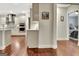Open kitchen featuring stainless steel appliances, pendant lighting, and hardwood flooring at 609 Francis Ave, Peachtree City, GA 30269