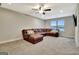 Spacious living room featuring a large sectional sofa and bright natural light at 609 Francis Ave, Peachtree City, GA 30269