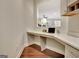 Office nook with built-in desk, hardwood floors, with view to Gathering room at 609 Francis Ave, Peachtree City, GA 30269