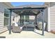 Cozy outdoor patio with a gazebo, seating area, and grill, creating a perfect space for relaxation and entertaining at 609 Francis Ave, Peachtree City, GA 30269