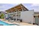 Community pool area featuring lounge chairs, patio tables, and an open-air pavilion at 609 Francis Ave, Peachtree City, GA 30269