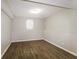 Unfinished basement area with wood-look flooring and a single window at 149 Camden Woods Pl, Dallas, GA 30157
