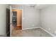 Finished basement room with neutral carpet, gray walls and open door at 149 Camden Woods Pl, Dallas, GA 30157