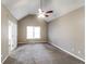 Relaxing bedroom with neutral walls, vaulted ceiling and carpet, perfect for unwinding after a long day at 149 Camden Woods Pl, Dallas, GA 30157