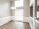 Dining area with wainscoting detail, complemented by natural light, and hardwood floors for a cozy ambiance at 149 Camden Woods Pl, Dallas, GA 30157