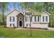 Charming two-story home featuring a stone entryway and well-maintained landscaping for curb appeal at 149 Camden Woods Pl, Dallas, GA 30157