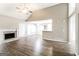 Bright living area with vaulted ceiling, fireplace and an open layout connecting to the dining and kitchen at 149 Camden Woods Pl, Dallas, GA 30157