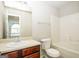 Bathroom with updated vanity and combination tub and shower at 3675 Arminto Dr, Ellenwood, GA 30294