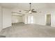 Spacious carpeted bedroom with a ceiling fan and walk-in closet at 3675 Arminto Dr, Ellenwood, GA 30294