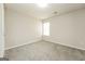Carpeted bedroom bathed in natural light from single window at 3675 Arminto Dr, Ellenwood, GA 30294