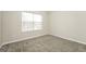 Bedroom with natural light and neutral walls at 3675 Arminto Dr, Ellenwood, GA 30294