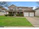 Charming two-story brick home with a well-manicured lawn, covered porch, and attached two-car garage at 3675 Arminto Dr, Ellenwood, GA 30294