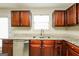 Kitchen features stainless steel dishwasher, granite countertops, and modern fixtures at 3675 Arminto Dr, Ellenwood, GA 30294