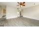 Spacious open living area with modern flooring and staircase to the upper level at 3675 Arminto Dr, Ellenwood, GA 30294