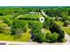 Aerial view showcasing the home nestled on a large lot surrounded by lush greenery and mature trees at 20 Rosser Rd, Mcdonough, GA 30252