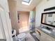 Bathroom with a skylight has stylish tile, a vanity with granite countertop, offering comfort and modern touch at 20 Rosser Rd, Mcdonough, GA 30252