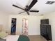 Bright bedroom showcasing a ceiling fan, closet, and bathroom access, offering a practical and comfortable design at 20 Rosser Rd, Mcdonough, GA 30252