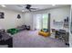 Roomy bedroom with carpet, natural light, work desk, and comfortable seating, perfect for relaxation and creativity at 20 Rosser Rd, Mcdonough, GA 30252