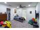 Nicely decorated bedroom with carpet, ceiling fan, and playful decor, creating a fun and vibrant space for children at 20 Rosser Rd, Mcdonough, GA 30252
