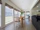 Inviting dining area with a wood table, white chairs, and many windows for lots of natural light at 20 Rosser Rd, Mcdonough, GA 30252