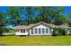 Exterior of a one-story house featuring a bright sunroom and well-manicured lawn at 20 Rosser Rd, Mcdonough, GA 30252