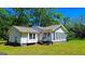 Charming single-story home featuring a sunroom with plenty of natural light at 20 Rosser Rd, Mcdonough, GA 30252