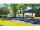 Charming single-story home with mature trees and a well-maintained lawn at 20 Rosser Rd, Mcdonough, GA 30252