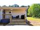 Welcoming front porch featuring outdoor seating and grilling area, perfect for relaxing at 20 Rosser Rd, Mcdonough, GA 30252