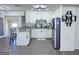 Bright updated kitchen with white cabinets, gray countertops, stainless appliances, and an island at 20 Rosser Rd, Mcdonough, GA 30252