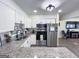 Kitchen with stainless appliances, white cabinets, granite countertops, and modern fixtures at 20 Rosser Rd, Mcdonough, GA 30252