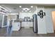 Bright updated kitchen with white cabinets, gray countertops, stainless appliances, and an island at 20 Rosser Rd, Mcdonough, GA 30252