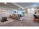 Open-concept living room featuring a plush sofa, stylish furnishings, and built-in shelving for storage and display at 20 Rosser Rd, Mcdonough, GA 30252