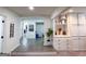 Lower level Gathering room featuring built in cabinets, shelving, and decor, offering a welcoming and organized living space at 20 Rosser Rd, Mcdonough, GA 30252