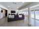 Expansive living room with open layout, modern furniture, and lots of natural light through many windows at 20 Rosser Rd, Mcdonough, GA 30252