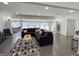Spacious living room featuring hardwood floors, a comfortable sectional, and an abundance of natural light at 20 Rosser Rd, Mcdonough, GA 30252