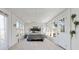 Bright bedroom with large windows, a comfortable bed, and minimalist decor at 20 Rosser Rd, Mcdonough, GA 30252
