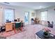 Office space in a versatile living room with dedicated desk, chair, and natural light at 20 Rosser Rd, Mcdonough, GA 30252