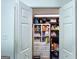 Pantry filled with food storage with shelving, cabinets, and white double doors at 20 Rosser Rd, Mcdonough, GA 30252