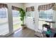 Bright sunroom entry with large windows, a tree, and wood floor at 20 Rosser Rd, Mcdonough, GA 30252