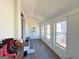 Charming sunroom with multiple windows and exterior access creating a relaxing space at 20 Rosser Rd, Mcdonough, GA 30252