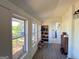 Bright sunroom featuring a shoe rack and multiple windows allowing ample natural light at 20 Rosser Rd, Mcdonough, GA 30252