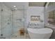 Modern bathroom featuring a glass shower, soaking tub, and white wood plank walls at 40 Butler Bridge Dr, Mcdonough, GA 30252