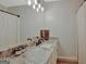 Bathroom featuring a granite countertop, undermount sink, framed mirror and vanity with great lighting at 40 Butler Bridge Dr, Mcdonough, GA 30252