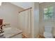 Bathroom with neutral walls, a shower with curtain, and a single-sink vanity with granite countertop at 40 Butler Bridge Dr, Mcdonough, GA 30252