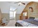 Sloped ceiling bedroom with wood accent wall and carpet floors at 40 Butler Bridge Dr, Mcdonough, GA 30252