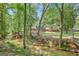View of a serene creek surrounded by lush trees, showcasing the natural beauty of the property at 40 Butler Bridge Dr, Mcdonough, GA 30252