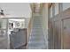 Inviting entryway with wooden door, staircase, and views of the open living space at 40 Butler Bridge Dr, Mcdonough, GA 30252
