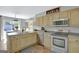 Well-equipped kitchen with stainless steel appliances and direct access to the dining area at 40 Butler Bridge Dr, Mcdonough, GA 30252