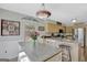 Eat-in kitchen features wooden cabinets, stainless steel appliances and a unique pendant light fixture at 40 Butler Bridge Dr, Mcdonough, GA 30252